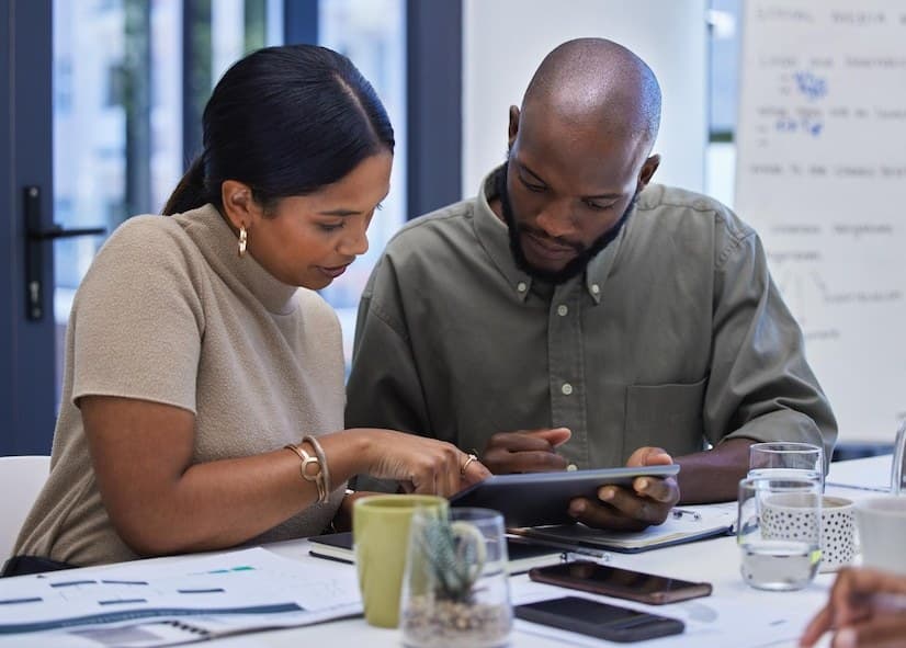 Two Verbosec team members reviewing a project together