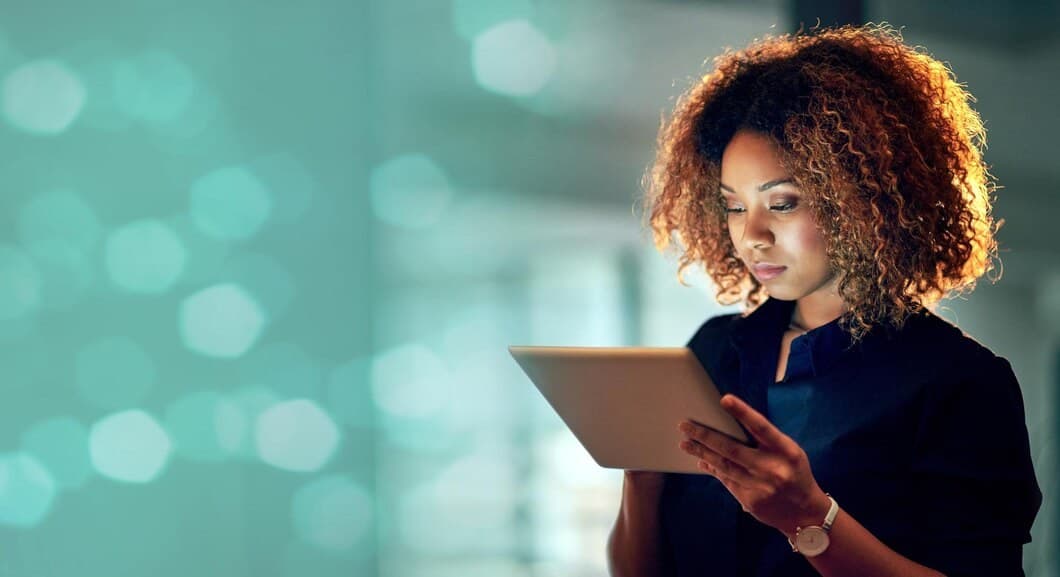 A Verbosec team member reviewing work on a tablet