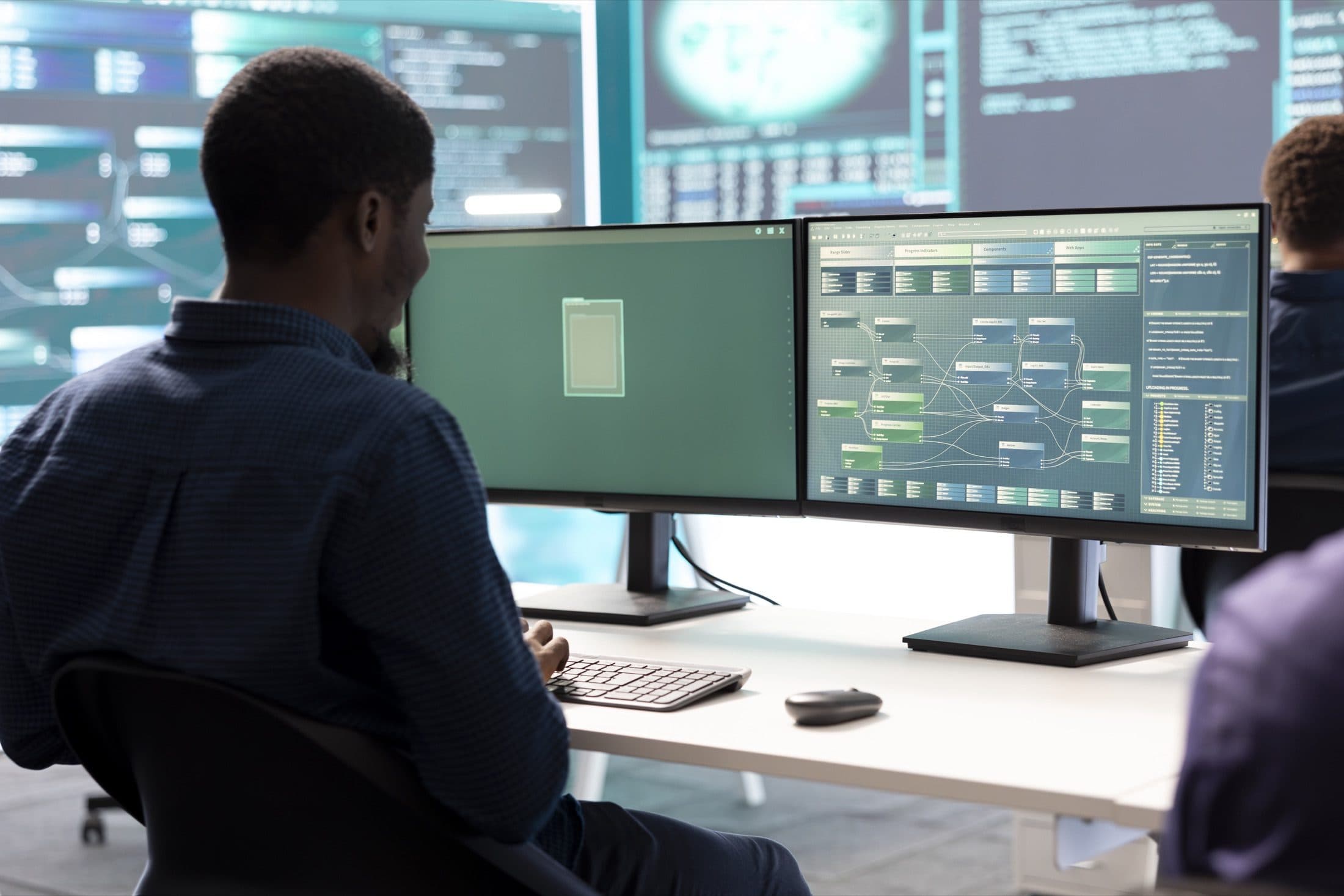 A security team monitoring systems together in an operations room
